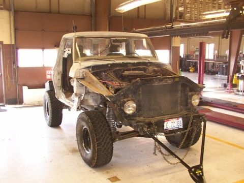 1978 Ford Bronco - This vehicle is in a workshop, appearing to be undergoing repairs or modifications.