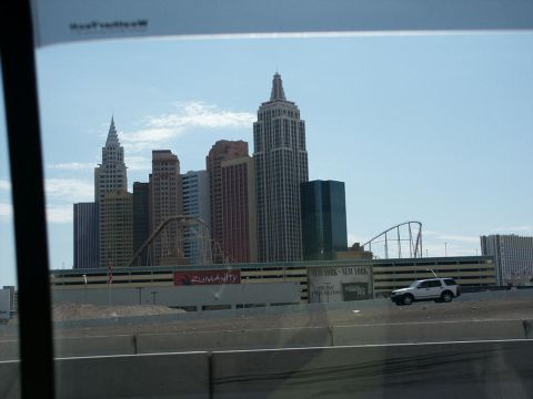 2001 Mercury Grand Marquis - A white SUV travels on a highway with the New York-New York Hotel & Casino in the background.