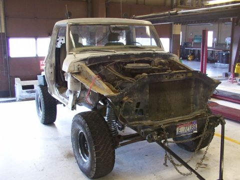 1978 Ford Bronco - This 1978 Ford Bronco is in a garage, appearing to be undergoing significant repairs or a rebuild.