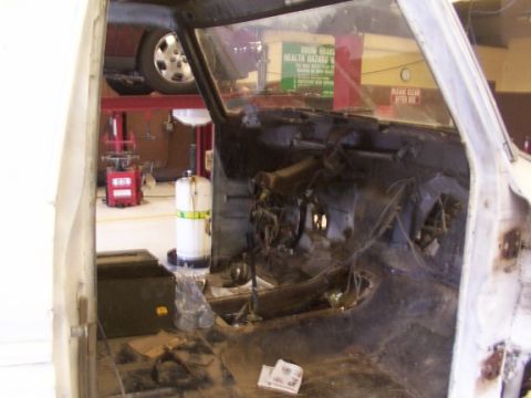 1978 Ford Bronco - Interior view of a 1978 Ford Bronco undergoing restoration, with most components removed.
