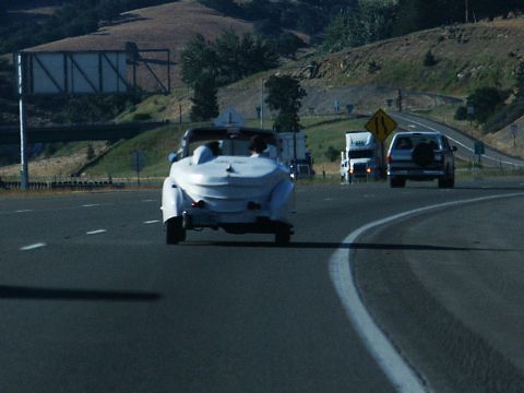 2001 Mercury Grand Marquis - Custom white convertible on a highway with other vehicles present.