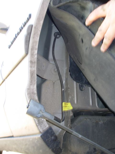 1994 Ford Crown Victoria - Pull the base down & out of the fender. The black plastic bezel can stay on top of the fender.