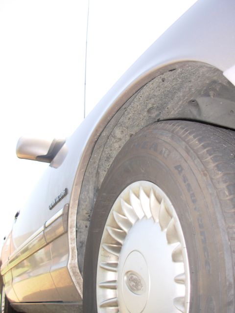 1994 Ford Crown Victoria - Push the insulation & wheelwell back into place, replace the wheel, and you're DONE!