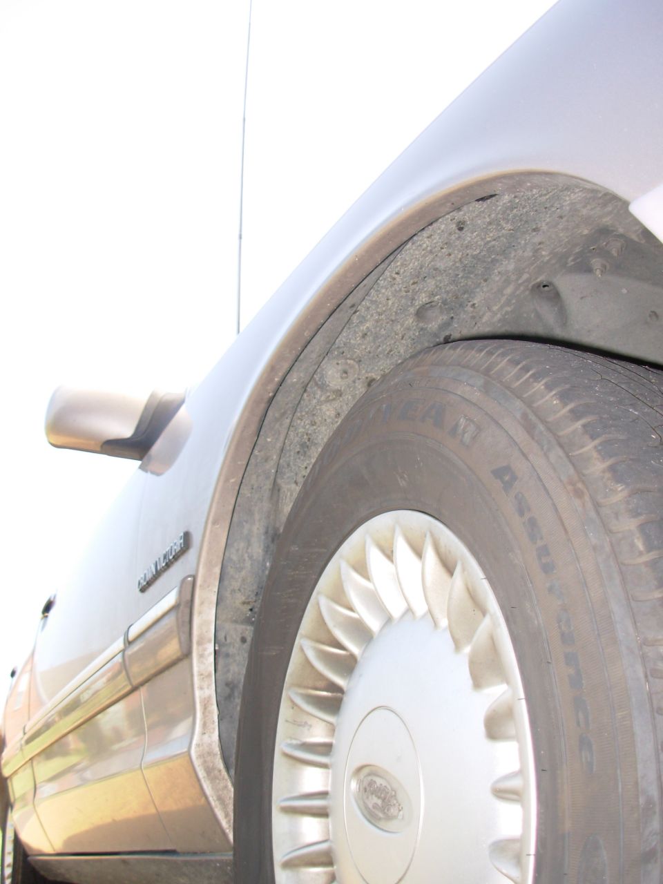 Push the insulation & wheelwell back into place, replace the wheel, and you're DONE!