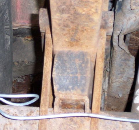 1979 Ford F-250 - Heavily rusted truck frame components are visible in this close-up shot.