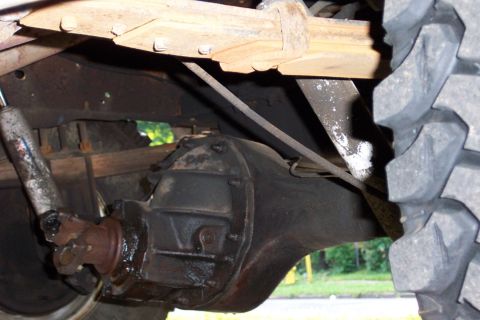1979 Ford F-250 - Underside view of a 1979 Ford F-250, showing the rear axle, driveshaft, and suspension components.