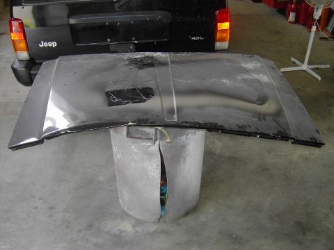 1995 Jeep YJ - Jeep Cherokee XJ rear view with hood off. The vehicle appears to be a later model.
