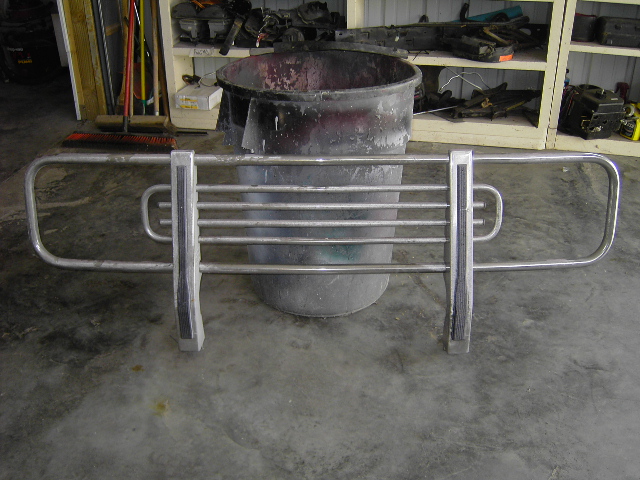 Chrome brush guard with horizontal bars and vertical supports