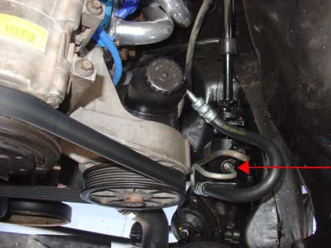 1988 Ford Bronco - This image shows a close-up view of the power steering system, including the pump and associated hoses.