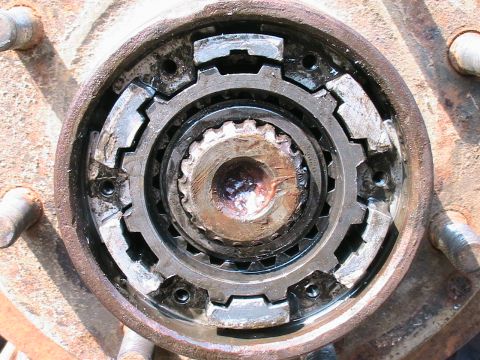 1977 Ford F-250 - Close-up of a rusty manual locking hub assembly, likely from a truck or SUV.