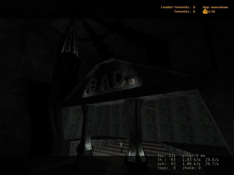 dark interior of a building with 'BAD' sign above entrance, stairs leading up, and a small figure at the bottom