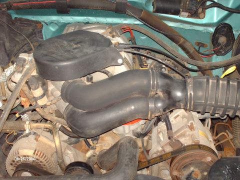 1994 Ford Bronco - Close-up view of an engine bay, showing various components including hoses, alternator, and wiring. A date stamp is visible in the lower le…