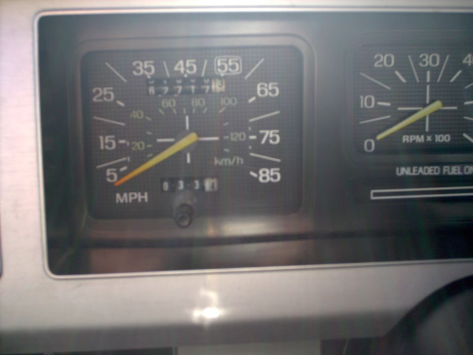 Interior dashboard of a 1982 Ford Bronco showing speedometer and tachometer
