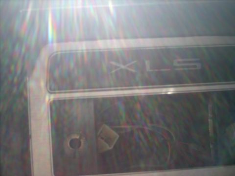 1982 Ford Bronco - Close-up of an interior trim panel showing the 'XLS' designation and exposed wiring.