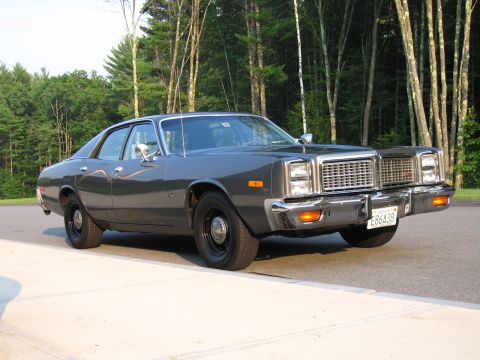 1991 Ford LTD Crown Victoria - This sedan features a distinctive grille and chrome bumper, typical of vehicles from the 1970s.