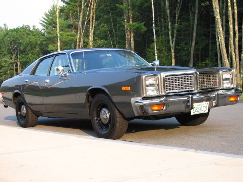 1991 Ford LTD Crown Victoria - This sedan features a prominent chrome grille and dual headlights.