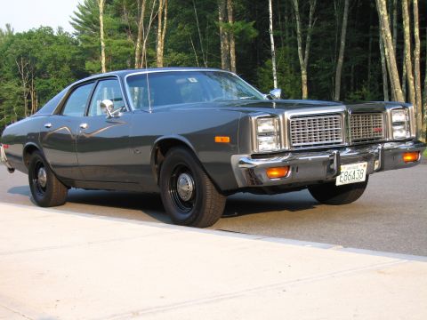 1991 Ford LTD Crown Victoria - This sedan features a distinctive grille and chrome accents, with a license plate visible on the front.