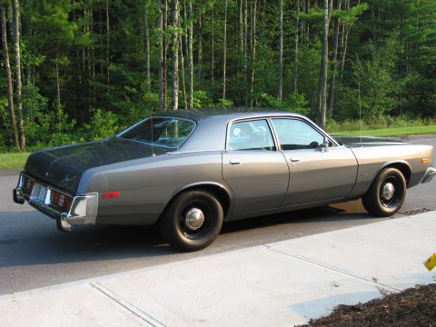 1991 Ford LTD Crown Victoria - This sedan has a two-tone paint job with a darker gray trunk and roof.