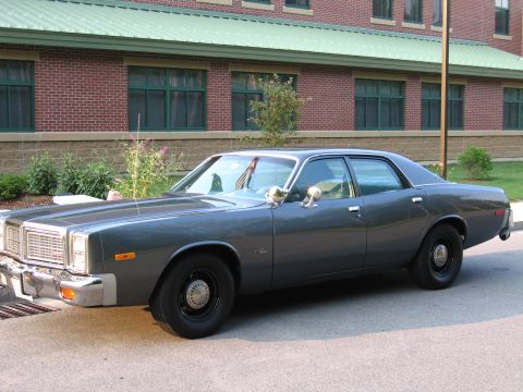 1991 Ford LTD Crown Victoria - This sedan features a distinctive grille and body style, suggesting a 1977 model year.