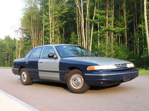 1991 Ford LTD Crown Victoria - This 1990 Ford Crown Victoria LTD sedan features a distinctive two-tone paint scheme of dark blue and silver.