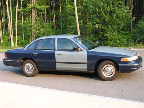 1991 Ford LTD Crown Victoria - This Ford Crown Victoria has a two-tone paint job, with the front half gray and the rear half blue.