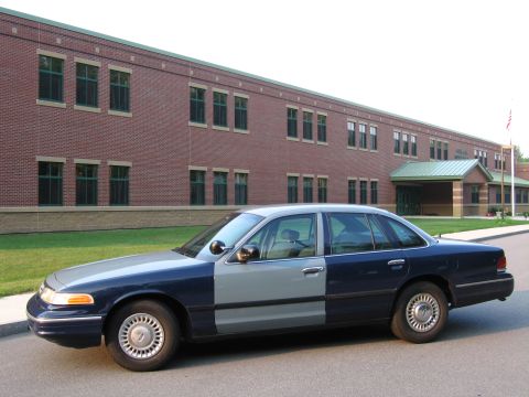 1991 Ford LTD Crown Victoria - This 1991 Ford Crown Victoria LTD sedan features a distinctive two-tone paint scheme with blue and gray sections.
