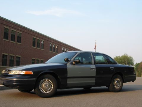 1991 Ford LTD Crown Victoria - This 1991 Ford Crown Victoria LTD sedan is seen from the side, a two-tone paint scheme.