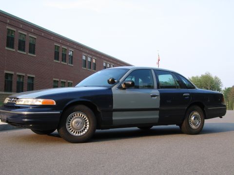 1991 Ford LTD Crown Victoria - This 1991 Ford Crown Victoria LTD has a two-tone paint scheme with dark blue and light gray sections.