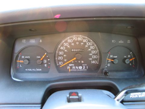 1991 Ford LTD Crown Victoria - Interior view of a car's dashboard gauges, including speedometer, fuel, oil, and temperature indicators.