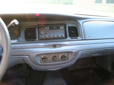 1991 Ford LTD Crown Victoria - Interior view of a car's dashboard, showing the steering wheel, radio, and climate controls.