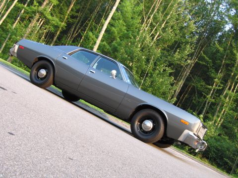 1991 Ford LTD Crown Victoria - This 1977 sedan has a classic full-size body style and is seen from a three-quarter front view.