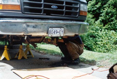 1995 Ford F-150 - Working on the front suspension of a 1995 Ford F-150, which is raised on jack stands.