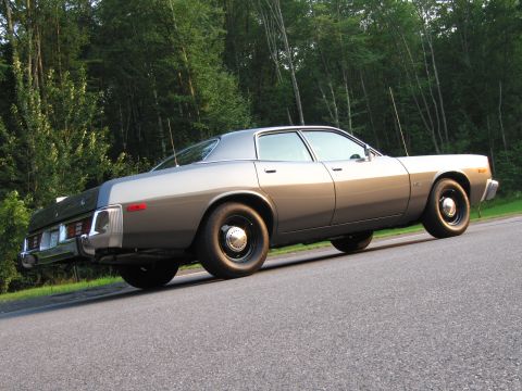 1991 Ford LTD Crown Victoria - This 1977 Dodge Monaco sedan is captured from a low angle, its gray paint and classic design.