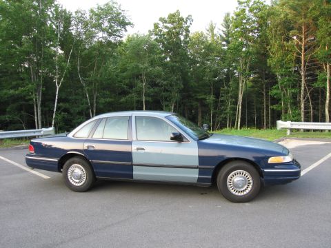 1991 Ford LTD Crown Victoria - This 1991 Ford Crown Victoria LTD is seen from the side, a two-tone blue paint scheme.
