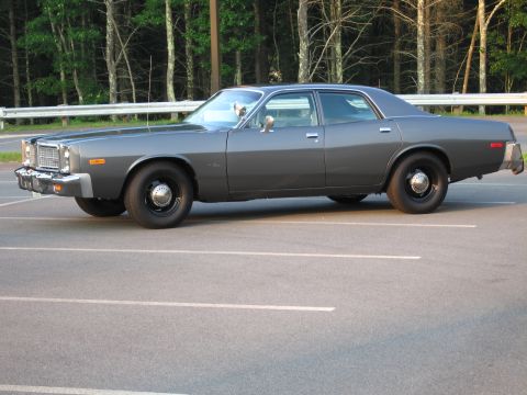 1991 Ford LTD Crown Victoria - This 1977 Dodge Monaco sedan is seen from the side in a parking lot.