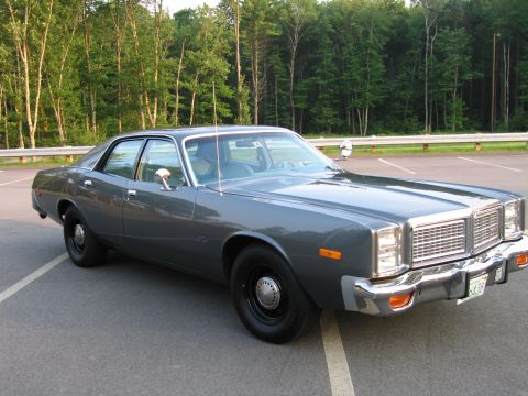 1991 Ford LTD Crown Victoria - This sedan features a distinctive chrome grille and bumper, with a license plate visible on the front.