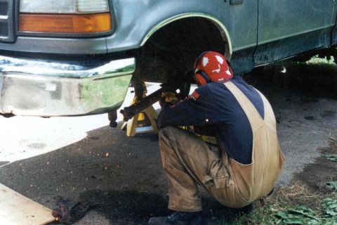 1995 Ford F-150 - Working on the front suspension of a 1995 Ford F-150, supported by jack stands.