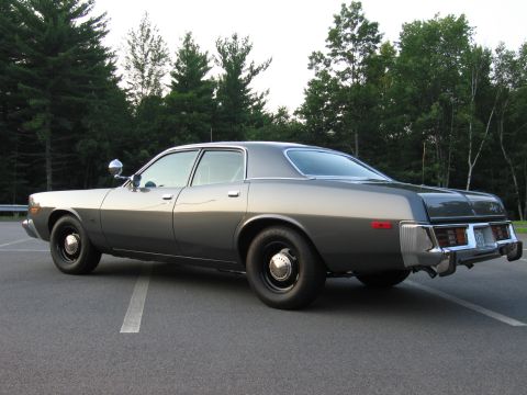 1991 Ford LTD Crown Victoria - This 1977 Dodge Monaco sedan is shown from the rear three-quarter angle.