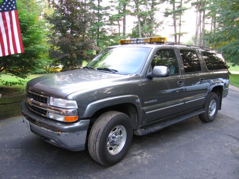 1991 Ford LTD Crown Victoria - This SUV is equipped with a light bar on its roof, suggesting it might be used for official purposes.