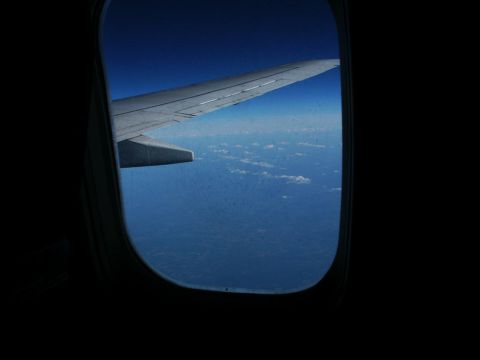 2001 Mercury Grand Marquis - View from an airplane window shows the wing and clouds.