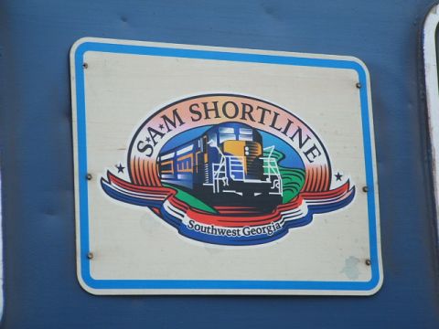 1966 Ford Ranchero - A logo depicting a train is affixed to a blue surface, displaying 'SAM SHORTLINE' and 'Southwest Georgia'.