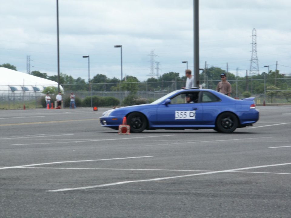 Blue coupe with racing number 355 D on the door, seen from the side