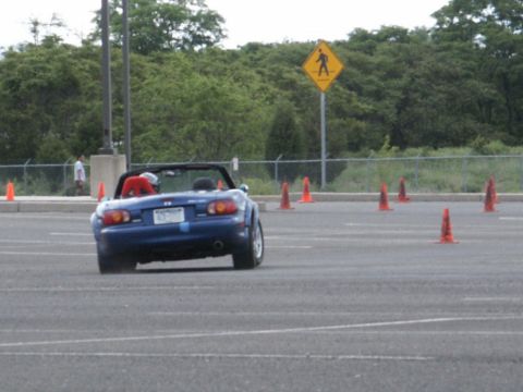 2001 Mercury Grand Marquis - A blue convertible navigates a course marked by orange traffic cones.