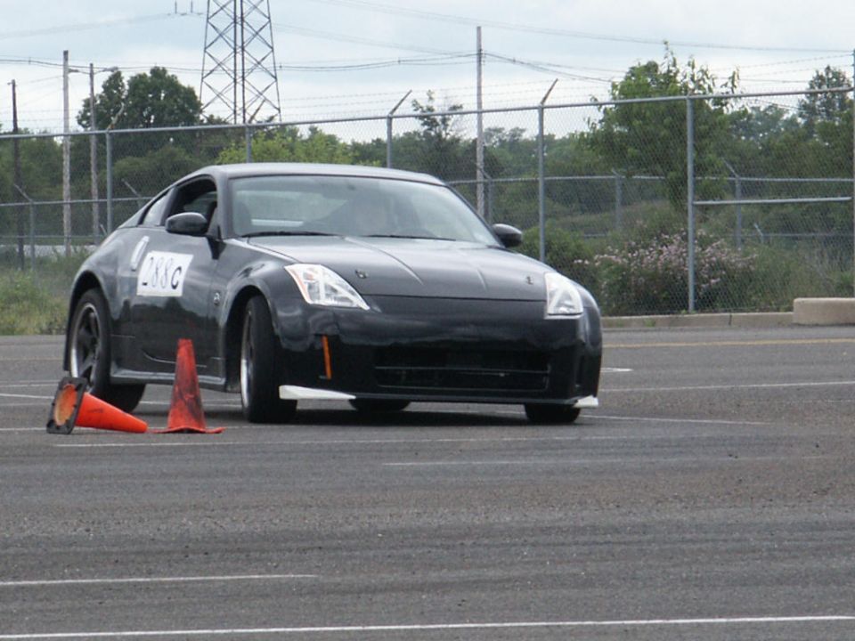 Black coupe with racing cones and number 288C on door