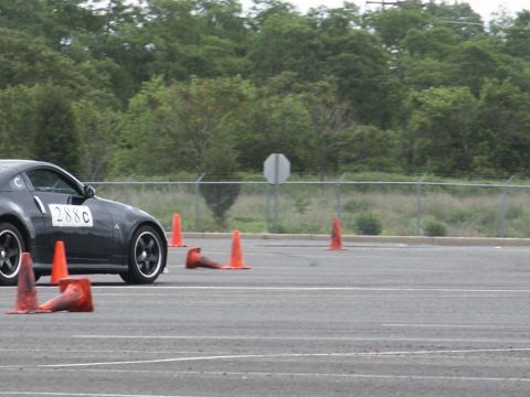 2001 Mercury Grand Marquis - Sports car with number 288C on door driving through an autocross course marked by orange cones.