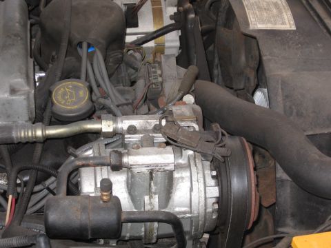 1988 Ford Crown Victoria LTD - The primary reason of taking this picture was for the A/C clutch, but I captured the Engine Oil dipstick and the fan assembly