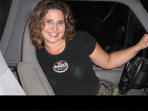 1995 Ford Bronco - Woman smiles from the driver's seat of a 1995 Ford Bronco.