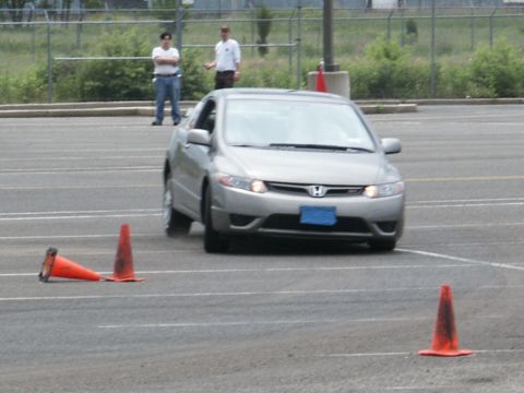 2001 Mercury Grand Marquis - A silver Honda Civic navigates a course marked by traffic cones.