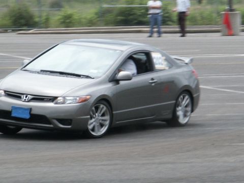 2001 Mercury Grand Marquis - A gray coupe is seen on a track, possibly during a performance driving event.