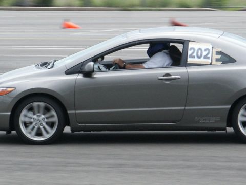 2001 Mercury Grand Marquis - Side view of a grey coupe participating in a timed event, with racing number 202 visible.